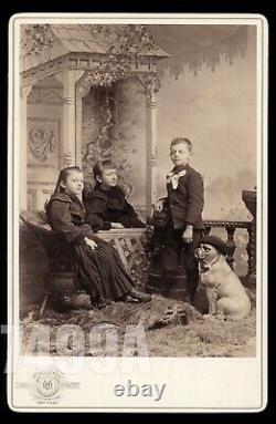 Funny Cabinet Photo NYC Photographer's Kids with Dog Statue Wearing Hat