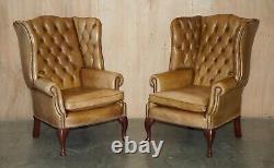 Pair Of Vintage Tan Brown Leather Chesterfield Wingback Chairs With Footstools