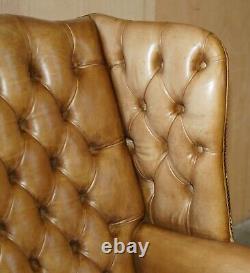 Pair Of Vintage Tan Brown Leather Chesterfield Wingback Chairs With Footstools