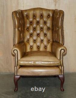 Pair Of Vintage Tan Brown Leather Chesterfield Wingback Chairs With Footstools