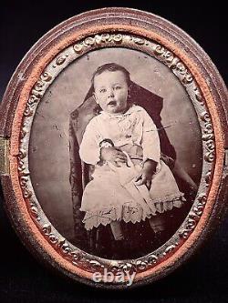 Very Rare 1/6 Plate Tintype Child Holding Doll In Oval Thermoplastic Case